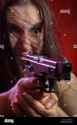 screaming-young-woman-with-gun-aiming-on-red-background-KWTX3F