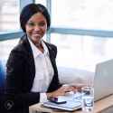 72494752-tight-square-shot-of-black-businesswoman-busy-smiling-while-looking-at-the-camera-with-her-hands