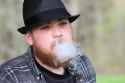 man-wearing-fedora-hat-blows-small-vape-cloud[1]