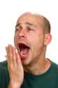 sleepy-man-yawning-covers-his-mouth-his-hand-as-yawns-funny-expression-43367402