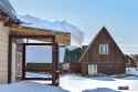 large-snowdrift-roof-rural-house-snow-accumulated-over-winter-slides-off-wooden-thaw-267085446