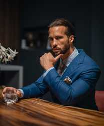 tristan-in-blue-suit-light-blue-shirt-and-striped-brown-tie