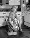 1960s-smiling-housewife-in-kitch