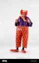 man-dressed-in-fancy-dress-comedy-costume-in-a-circus-clown-outfit-E8MDW1