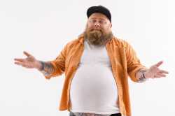 joyful-thick-guy-gesturing-innocently-fat-bearded-man-standing-stretching-arms-sideways-looking-camera-75730255