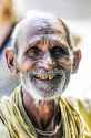 78382443-khajuraho-india-september-17-2010-old-indian-man-face-smiling-and-looking-on-a-photographer