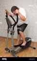 overweight-man-exercising-on-trainer-2BY7AD4