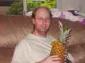 man holding ananas