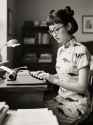 jimeng-2025-05-06-34-Historical photograph, 1960&#039;s black and white photo, at typewriter, writing, at...
