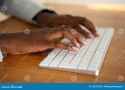 close-up-female-hands-typing-computer-keyboard-african-american-130537538-2703381760