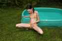 small-thin-girl-peeing-next-to-paddling-pool-5