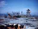 View over the damaged flight deck of USS Franklin (CV-13) off Manhattan on 28 April 1945