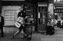 Woman With Guitar In Greenwich Village