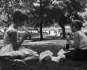 Two young women eating lunch in Central Park. July 1961.