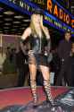 2002-Britney-shows-up-dominatrix-style-getup-complete-leather-newsboy-cap-lace-up-heels