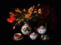 tea_pot_cups_nuts_and_a_vase_of_flowers