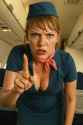 20250514_2053_Retro Stewardess Scolding_remix_01jv8pv7d8eyz88t2x76axpe1f