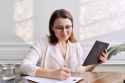 businesswoman making handwritten notes