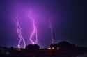 lightning over houses