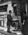 1877 A Cough drop salesman on the streets of London