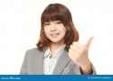 young-japanese-woman-thumbs-up-gesture-businesswoman-196501618