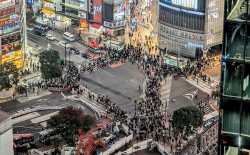 Shibuya_scramble_crossing_during_Halloween_2023,_actually_less_crowded_than_usual,_high_police_presence_2