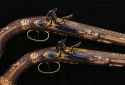 A pair of gold-mounted Nicolas-Noel Boutet French Empire Officer’s flintlock pistols presented to Contre-Amiral Cesar-Joseph Bourayne, Baron de l’Empire