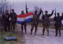 SVK soldiers pose with a captured Croatian flag during Operation Flash.