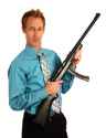 13319-a-young-businessman-holding-a-rifle-pv-3603590377