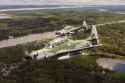 1920px-Aeronave_A-29_Super_Tucano_em_voo_sobre_a_Floresta_Amazônica