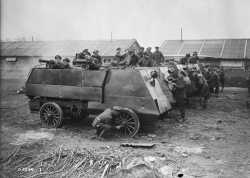 Cleaning_armoured_cars,_Canadian_Motor_Machine_Gun_Brigade_April_1918_LAC_3395367