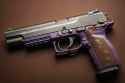 ai-generated-pistol-on-a-brown-background-generative-ai-free-photo
