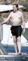 60412275-11025553-Beach_ready_The_billionaire_donned_black_swim_shorts_for_the_aft-a-1_1658178668604-2520199898