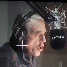 Jeremy Irons speaking into a microphone