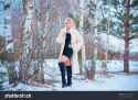 stock-photo--oncept-of-femininity-and-elegance-in-the-female-look-beauty-on-a-background-of-a-winter-landscape-1025107807