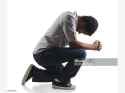 Screenshot 2025-05-19 at 21-29-02 Young Man Praying On His Knees Stock Photo - Download Image Now - Kneeling Men Praying - iStock