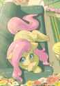 2799130__safe_artist-colon-yanamosuda_fluttershy_pegasus_pony_aside+glance_blushing_couch_crepuscular+rays_cute_female_floppy+ears_flower_folded+wings_indoors_l