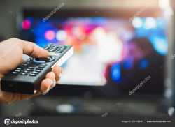 holding remote stock photo