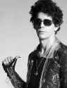 Lou Reed is pointing at himself...