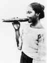 Young_native_girl_of_Siam_holding_a_cigar_Wellcome_M0002413