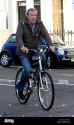 jeremy-clarkson-arrives-at-his-home-in-west-london-on-a-bicycle-as-G7TJ96