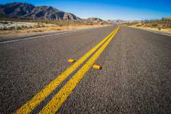 double-yellow-lines-down-the-middle-of-a-highway-road-scaled-1[1]