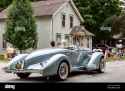 an-antique-light-blue-1935-auburn-speedster-boattail-passes-slowly-through-auburn-indiana-during-the-2019-auburn-cord-duesenberg-festival-parade-2FN0NTN