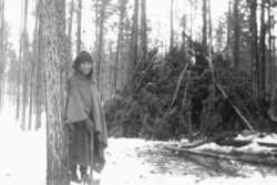 Weir-7.-Chiwid-and-her-brush-house-near-Tatla-Lake.-Graham-family-photo.--e1620477797238