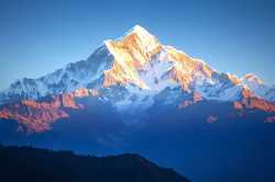 annapurna-south-peak-glowing-sunrise-himalayas-brilliantly-nepal-capturing-breathtaking-beauty-majestic-presence-357485241