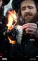 rabbi-beck-hold-the-burning-israeli-passport-of-rabbi-greenberg-at-B76PH5