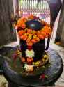 shiva-linga-shrine-mahakal-lord-rock-temple-decorated-flower-garland-353290949