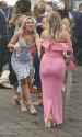 69831029-11972335-One_racegoer_dressed_in_pink_held_on_to_her_umbrella_as_she_star-a-137_1681895556255