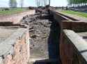 1280px-Entrance_to_Crematorium_III_in_Auschwitz_II_(Birkenau)