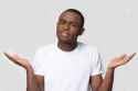 134617049-confused-african-american-man-shrugging-shoulders-looking-at-camera-uncertain-customer-client